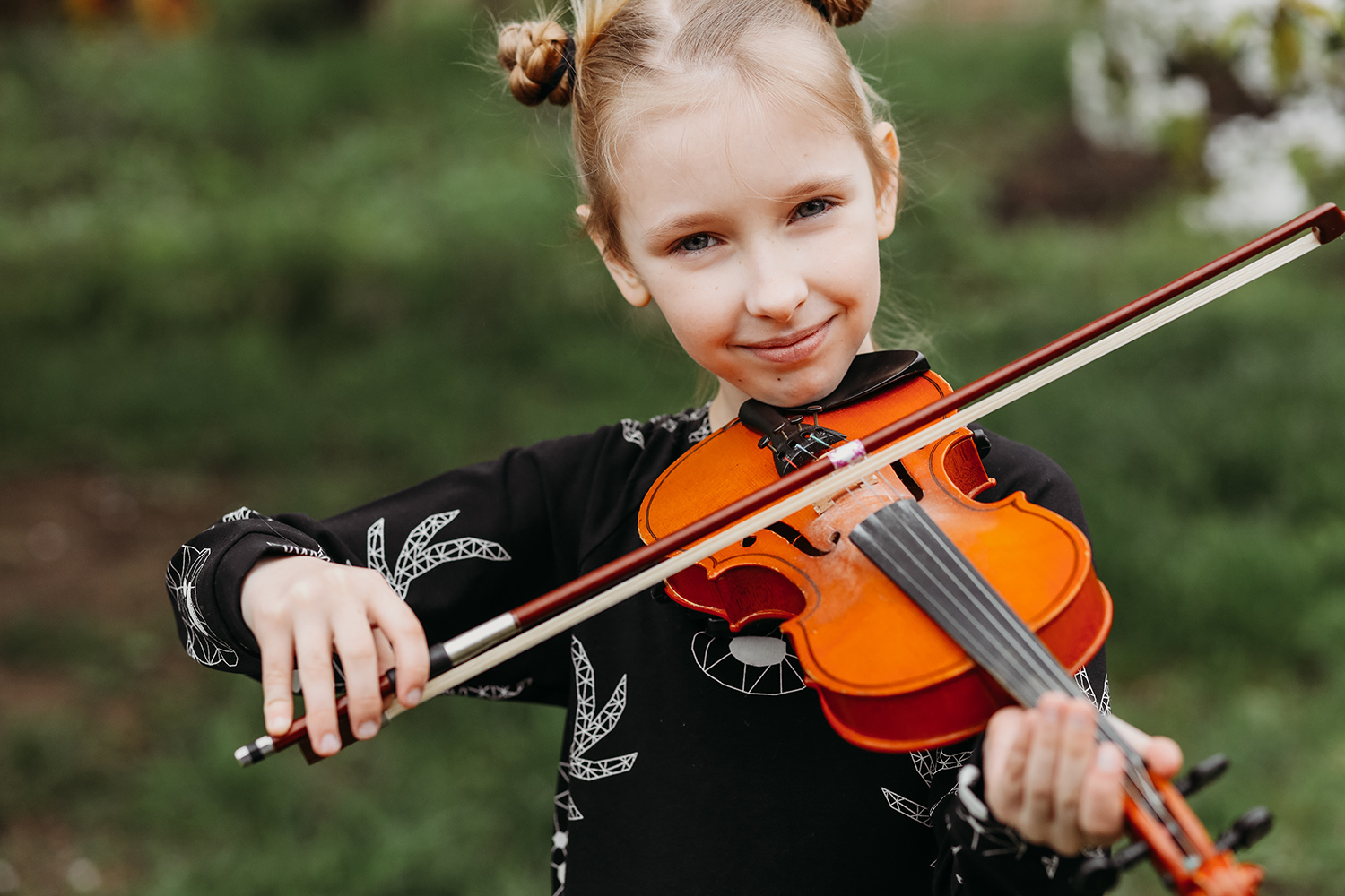 Girl with violin outside hair up